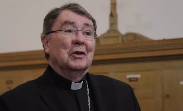 Cardinal Christophe Pierre speaks to reporters after a mass in solidarity with migrants at the Chapel of St. Thomas Aquinas on Friday, Feb. 27, 2026 in St. Paul, Minn. (AP Photo/Mark Vancleave)