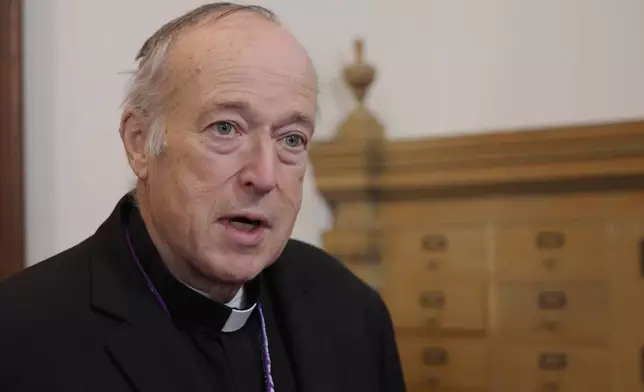 Cardinal Robert speaks to reporters after a mass in solidarity with migrants at the Chapel of St. Thomas Aquinas on Friday, Feb. 27, 2026 in St. Paul, Minn. (AP Photo/Mark Vancleave)