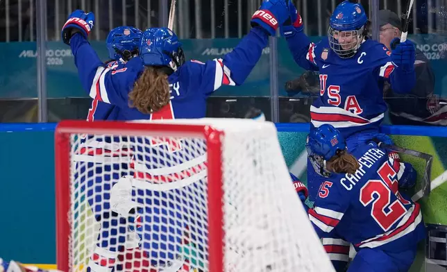 United States' Hilary Knight, right, celebrates with teammates after scoring her sides fourth goal during a preliminary round match of women's ice hockey between United States and Czechia at the 2026 Winter Olympics, in Milan, Italy, Thursday, Feb. 5, 2026. (AP Photo/Petr David Josek)
