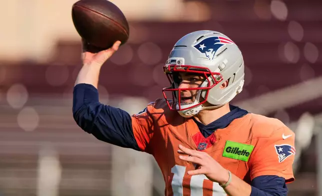 New England Patriots quarterback Drake Maye looks to pass during practice ahead of the Super Bowl 60 NFL football game against the Seattle Seahawks, Wednesday, Feb. 4, 2026, in Stanford, Calif. (AP Photo/Charlie Riedel)
