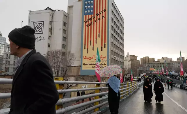 People attend a state-organised rally in Tehran, Iran, Wednesday, Feb. 4, 2026, celebrating the birthday of Imam Mahdi, or "Hidden Imam," a 9th-century saint whom Shiite Muslims believe will return at the end of time as a universal reformer to end tyranny and promote justice. (AP Photo/Vahid Salemi)