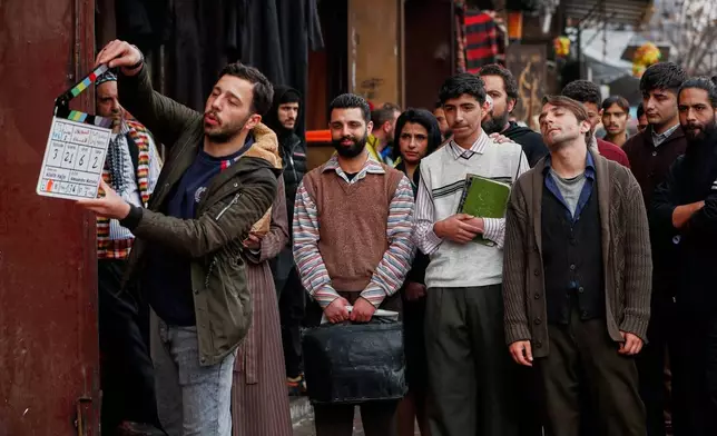 A television crew films an episode of the TV series "Al-Souriyoun al-Aada" ("The Syrian Enemies"), based on a novel of the same name that was banned under Bashar Assad, in central Aleppo, Syria, Friday, Feb. 13, 2026.(AP Photo/Omar Sanadiki)