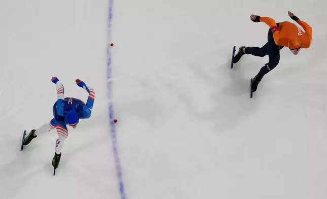 Jordan Stolz of the United States, left, and Jenning De Boo of the Netherlands compete during the speed skating men's 500m at the 2026 Winter Olympics, in Milan, Italy, Saturday, Feb. 14, 2026. (AP Photo/Christophe Ena)