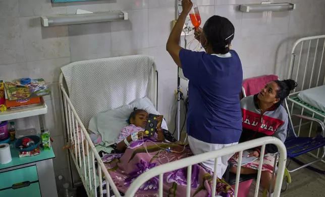 Carolina Silva Matos, a cancer patient, rests in a hospital bed at the National Institute of Oncology and Radiology in Havana, Cuba, Friday, Feb. 20, 2026. (AP Photo/Ramon Espinosa)