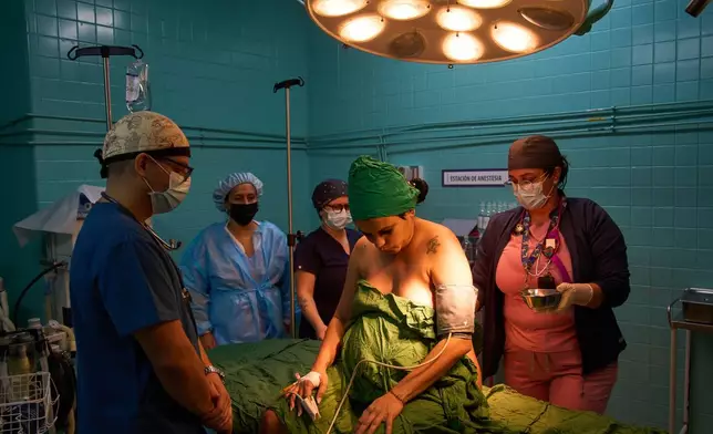 Daimara de la Fe Viera sits in an operating room before her cesarean delivery at the Ramón González Coro Maternity Hospital in Havana, Cuba, Friday, Feb. 20, 2026. (AP Photo/Ramon Espinosa)