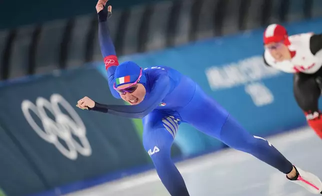 Francesca Lollobrigida of Italy, left, and Canada's Valerie Maltais, right, compete in the women's 3,000 meters speedskating race at the 2026 Winter Olympics, in Milan, Italy, Saturday, Feb. 7, 2026. (AP Photo/Christophe Ena)