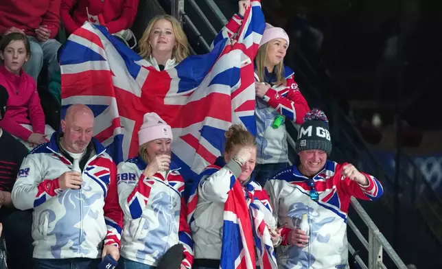 Britain fans watch the men's curling round robin session against the United States, at the 2026 Winter Olympics, in Cortina d'Ampezzo, Italy, Wednesday, Feb. 18, 2026. (AP Photo/Misper Apawu)