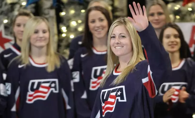 FILE - Gigi Marvin, of Warroad, Minn., waves as she is introduced as a member of the 2010 U.S. Olympic Women's Ice Hockey Team in Bloomington, Minn., Thursday, Dec. 17, 2009. (Bruce Bisping/Star Tribune via AP)