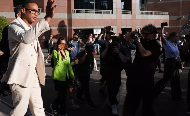 Journalist Don Lemon, waves after leaving a hearing at the Edward R. Roybal Federal Building in Los Angeles on Friday, Jan. 30, 2026. (AP Photo/Damian Dovarganes)