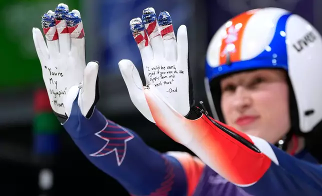 United States' Sophia Kirkby poses during the luge relay competition at the 2026 Winter Olympics, in Cortina d'Ampezzo, Italy, Thursday, Feb. 12, 2026. (AP Photo/Alessandra Tarantino)