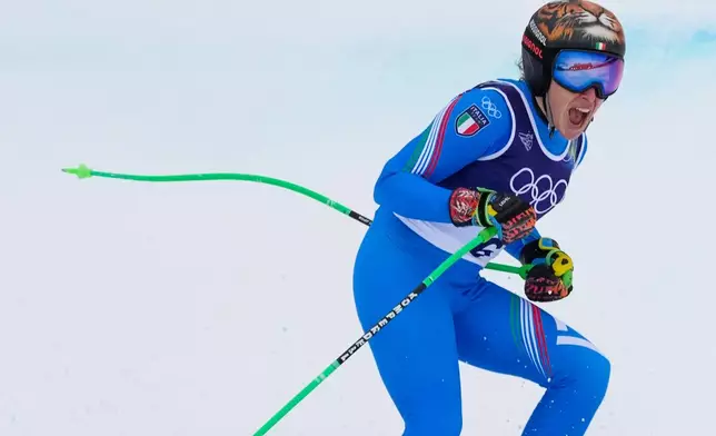 Italy's Federica Brignone reacts at the finish area, during an alpine ski, women's super-G race, at the 2026 Winter Olympics, in Cortina d'Ampezzo, Italy, Thursday, Feb. 12, 2026. (AP Photo/Andy Wong)