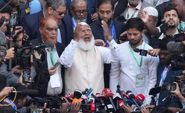 Jamaat-e-Islami leader Shafiqur Rahman, center, addresses to the media after casting his vote at a polling station during national parliamentary election in Dhaka, Bangladesh, Thursday, Feb. 12, 2026. (AP Photo/Anupam Nath)