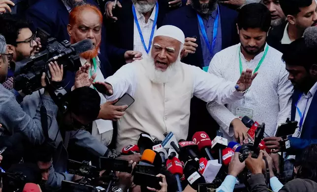 Jamaat-e-Islami leader Shafiqur Rahman, centre, addresses to the media after casting his vote at a polling station during national parliamentary election in Dhaka, Bangladesh, Thursday, Feb. 12, 2026. (AP Photo/Anupam Nath)