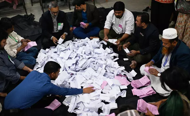 Polling officials begin the counting of votes cast in Bangladesh's national parliamentary election, in Dhaka, Bangladesh, Thursday, Feb. 12, 2026. (AP Photo/Mahmud Hossain Opu)