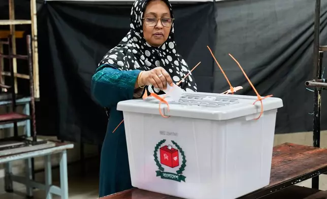 A woman casts her vote at a polling station during national parliamentary election in Dhaka, Bangladesh, Thursday, Feb. 12, 2026. (AP Photo/Anupam Nath)