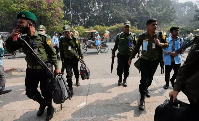 Security personnel arrive to collect ballot boxes and voting materials at a distribution centre ahead of Thursday's national parliamentary election, in Dhaka, Bangladesh, Wednesday, Feb. 11, 2026. (AP Photo/Anupam Nath)