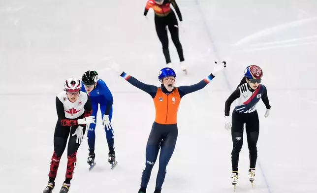 Gold medalist Xandra Velzeboer of the Netherlands celebrates after the short track speed skating women's 1000m at the 2026 Winter Olympics, in Milan, Italy, Monday, Feb. 16, 2026. (AP Photo/Natacha Pisarenko)