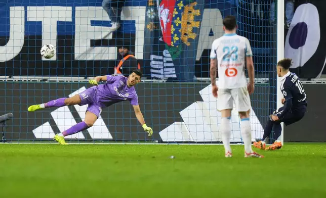 Paris FC's Ilan Kebbal, right, scores his side's 2nd goal from the penalty spot during the French League One soccer match between Paris FC and Marseille in Paris, Saturday, Jan. 31, 2026. (AP Photo/Thibault Camus)