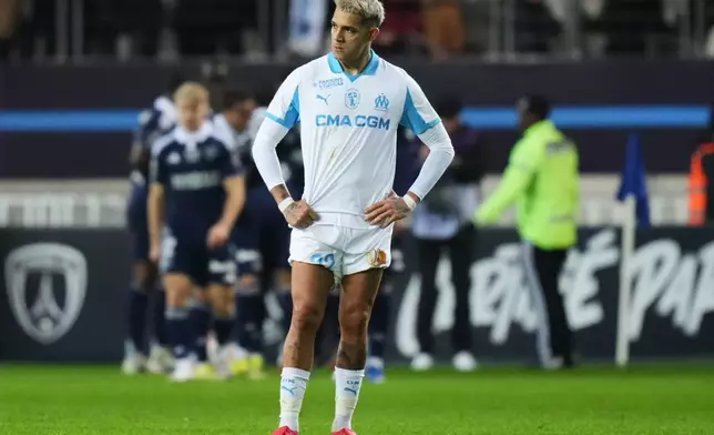 Marseille's Facundo Medina reacts after Paris FC's Ilan Kebbal scoring from the penalty spot during the French League One soccer match between Paris FC and Marseille in Paris, Saturday, Jan. 31, 2026. (AP Photo/Thibault Camus)