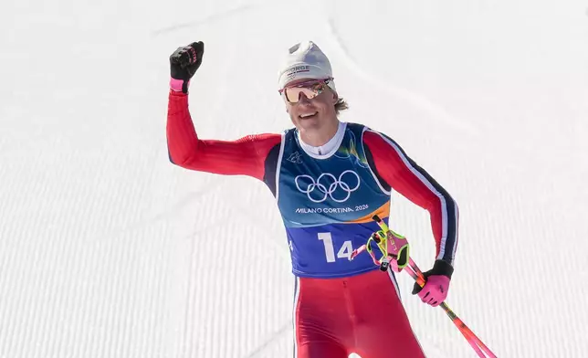 Johannes Hoesflot Klaebo, of Norway, approaches the finish line to win the gold medal in the cross country skiing men's 4 x 7.5km relay at the 2026 Winter Olympics, in Tesero, Italy, Sunday, Feb. 15, 2026. (AP Photo/Evgeniy Maloletka)