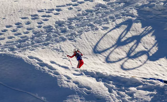 Johannes Hoesflot Klaebo, of Norway, skis uphill during the cross country skiing men's 4 x 7.5km relay at the 2026 Winter Olympics, in Tesero, Italy, Sunday, Feb. 15, 2026. (AP Photo/Matthias Schrader)