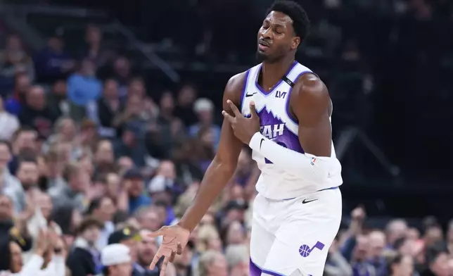 Utah Jazz forward Jaren Jackson Jr. reacts after making a three point basket against the Sacramento Kings during the first half of an NBA basketball game, Wednesday, Feb. 11, 2026, in Salt Lake City. (AP Photo/Rob Gray)