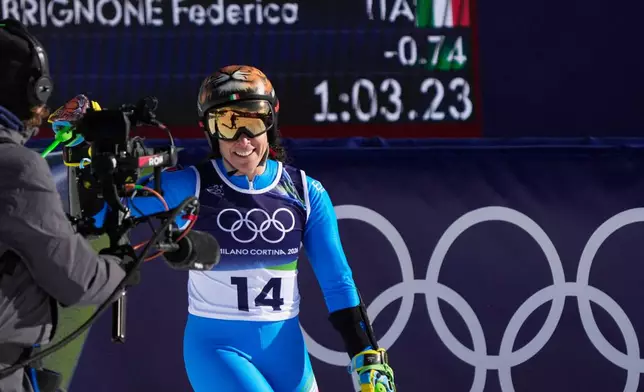 Italy's Federica Brignone at the finish area of an alpine ski, women's giant slalom race, at the 2026 Winter Olympics, in Cortina d'Ampezzo, Italy, Sunday, Feb. 15, 2026. (AP Photo/Andy Wong)