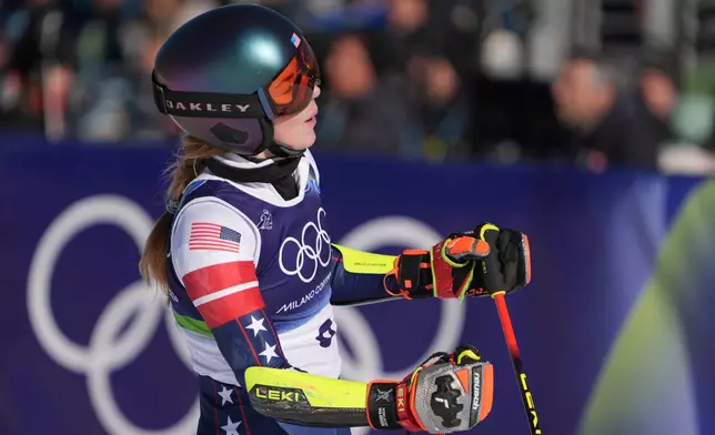 United States' Mikaela Shiffrin at the finish area of an alpine ski, women's giant slalom race, at the 2026 Winter Olympics, in Cortina d'Ampezzo, Italy, Sunday, Feb. 15, 2026. (AP Photo/Jacquelyn Martin)
