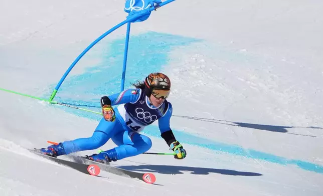 Italy's Federica Brignone competes during an alpine ski, women's giant slalom race, at the 2026 Winter Olympics, in Cortina d'Ampezzo, Italy, Sunday, Feb. 15, 2026. (AP Photo/Jacquelyn Martin)