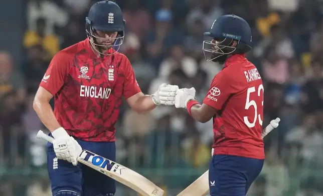 England's Will Jacks, left, and Rehan Ahmed encourage each other as they bat during the T20 World Cup cricket match between England and New Zealand in Colombo, Sri Lanka, Friday, Feb. 27, 2026. (AP Photo/Eranga Jayawardena)