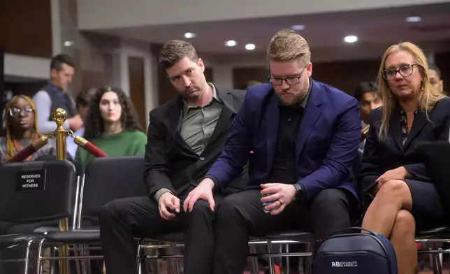 Brent Ganger, left, and Luke Ganger, right, brothers of Renee Good, listen to the testimony of the other witnesses, during a Bicameral Public Forum on the Disproportionate Use of Force by DHS Agents, on Capitol Hill, Tuesday, Feb. 3, 2026, in Washington. (AP Photo/Rod Lamkey, Jr.)