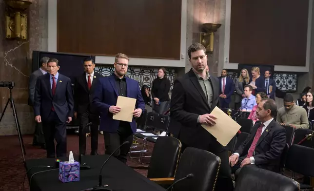 Sen. Richard Blumenthal, D-Conn., left, Rep. Robert Garcia, D-Calif., second from left, Luke Ganger, second from right, and Brent Ganger, right, brothers of Renee Good, arrive during a Bicameral Public Forum on the Disproportionate Use of Force by DHS Agents, on Capitol Hill, Tuesday, Feb. 3, 2026, in Washington. (AP Photo/Rod Lamkey, Jr.)