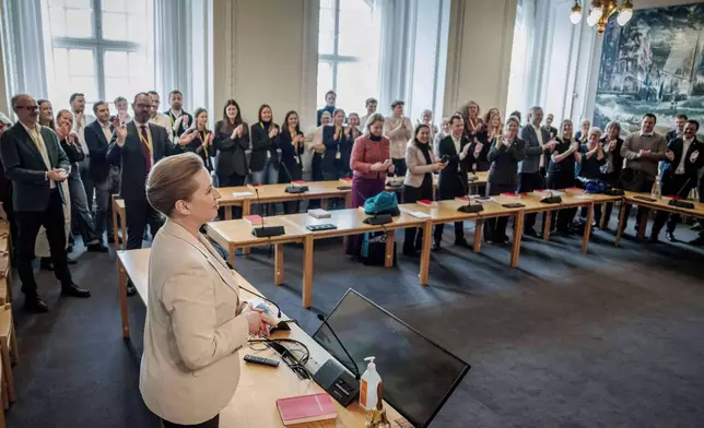 Danish Prime Minister Mette Frederiksen speaks in the Folketing hall, the Danish parliament, in Copenhagen, Thursday, Feb. 26, 2026. (Thomas Traasdahl/Ritzau Scanpix via AP)