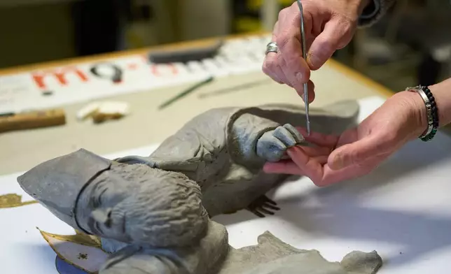 Massimiliano Trubbiani, an expert in tactile education for blind and visually impaired people, works to transform Titian's Pala Gozzi into bas-relief in a laboratory at the Omero Tactile Museum in Ancona, Italy, Friday, Jan. 16, 2026. (AP Photo/Alessandra Tarantino)
