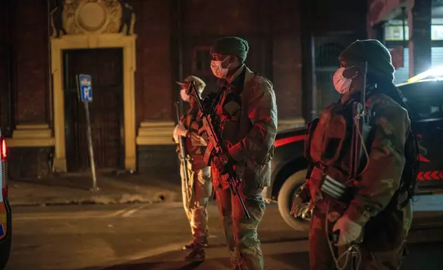 FILE - South African Defense Forces patrol downtown Johannesburg, South Africa, March 27, 2020. (AP Photo/Jerome Delay, File)