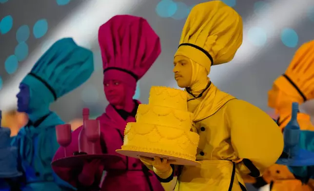 Dancers perform during the Olympic opening ceremony at the 2026 Winter Olympics, in Milan, Italy, Friday, Feb. 6, 2026. (AP Photo/Ashley Landis)