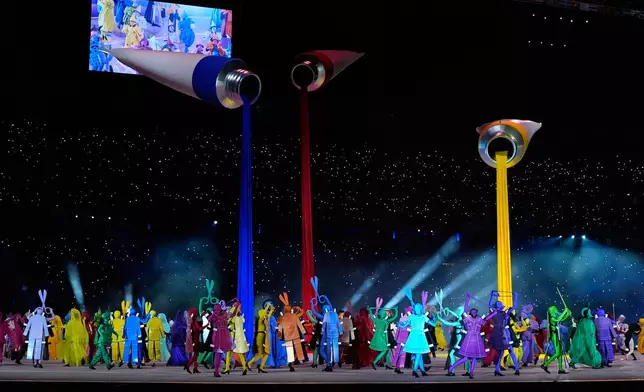 Dancers perform during the Olympic opening ceremony at the 2026 Winter Olympics, in Milan, Italy, Friday, Feb. 6, 2026. (AP Photo/Ashley Landis)