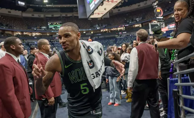 New Orleans Pelicans guard Dejounte Murray (5) reacts after his team's victory over the Golden State Warriors in an NBA basketball game in New Orleans, Tuesday, Feb. 24, 2026. (AP Photo/Matthew Hinton)