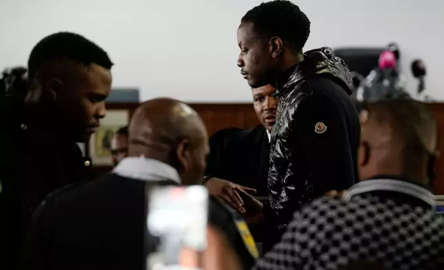 Bellarmine Chatunga Mugabe, son of former Zimbabwe President Robert Mugabe, leaves following his appearance at the Alexandra Magistrates Court in Johannesburg, South Africa, Monday, Feb. 23, 2026, on charges stemming from last week's shooting incident at his home in Hyde Park. (AP Photo/Themba Hadebe)