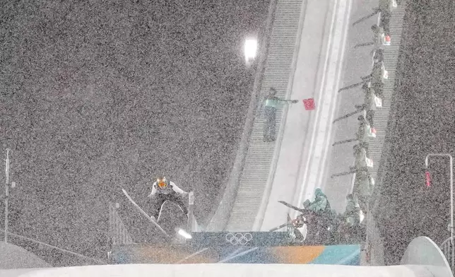 Domen Prevc, of Slovenia, launches off the ramp during his final round jump of the ski jumping men's super team competition at the 2026 Winter Olympics, in Predazzo, Italy, Monday, Feb. 16, 2026. (AP Photo/Matthias Schrader)