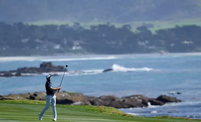 Sam Burns hits from the 18th fairway at Pebble Beach Golf Links during the first round of the AT&amp;T Pebble Beach Pro-Am golf tournament in Pebble Beach, Calif., Thursday, Feb. 12, 2026. (AP Photo/Godofredo A. Vásquez)