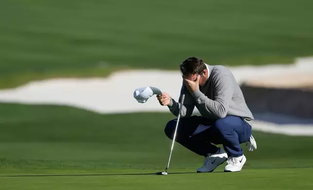 Scottie Scheffler reacts before putting on the 18th green at Pebble Beach Golf Links during the first round of the AT&amp;T Pebble Beach Pro-Am golf tournament in Pebble Beach, Calif., Thursday, Feb. 12, 2026. (AP Photo/Godofredo A. Vásquez)