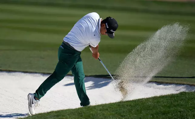 Ryo Hisatsune, of Japan, slams his club into the sand of a fairway bunker at the 10th hole after hitting a shot during the final round of the Phoenix Open golf tournament Sunday, Feb. 8, 2026, in Scottsdale, Ariz. (AP Photo/Ross D. Franklin)