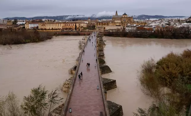 The Guadalquivir River overflows its banks as it passes through Cordoba, in southern Andalusia, Spain, Wednesday, Feb. 4, 2026, as heavy rains across the country cause flooding in the region. (Madero Cubero/Europa Press via AP)