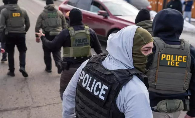 FILE - Federal agents conduct immigration enforcement operations Thursday, Feb. 5, 2026, in Minneapolis. (AP Photo/Ryan Murphy, File)