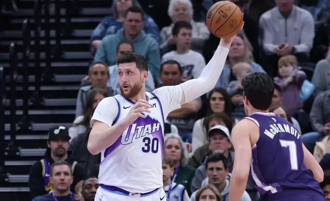 Utah Jazz center Jusuf Nurkic (30) looks to pass the ball against the Sacramento Kings during the first half of an NBA basketball game, Wednesday, Feb. 11, 2026, in Salt Lake City. (AP Photo/Rob Gray)