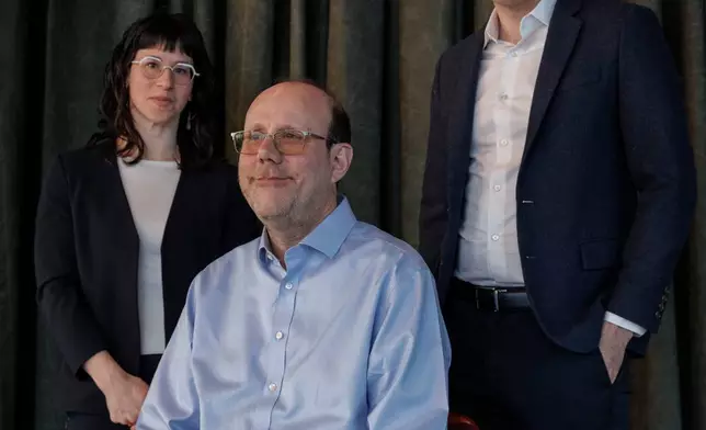 Sasha Gallant, cofounder of the DIV Fund, left, Michael Kremer, the DIV Fund's scientific director and a Nobel prize winning economist, center, and Otis Reid, executive director of Global Health &amp; Wellbeing at Coefficient Giving, pose for a portrait Thursday, Feb. 5, 2026, in Washington. (AP Photo/Moriah Ratner)