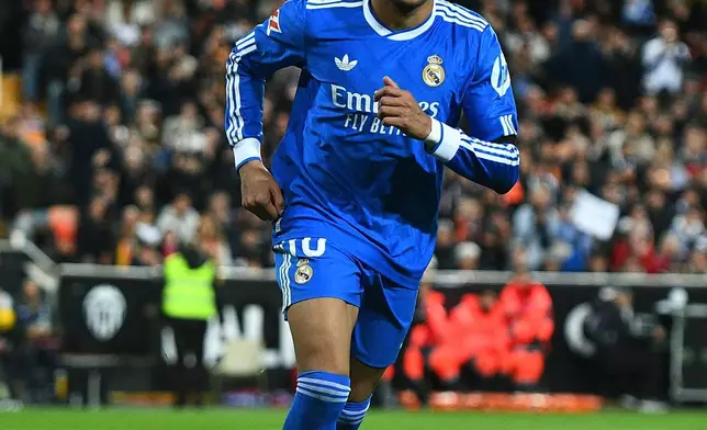 Real Madrid's Kylian Mbappe celebrates after scoring his side's second goal during the Spanish La Liga soccer match between Valencia and Real Madrid in Valencia, Spain, Sunday, Feb. 8, 2026. (AP Photo/Francisco Macia)