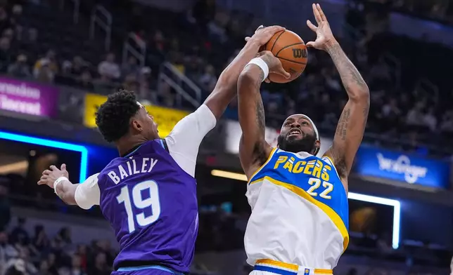 Utah Jazz forward Ace Bailey (19) blocks the shot of Indiana Pacers forward Isaiah Jackson (22) during the second half of an NBA basketball game in Indianapolis, Tuesday, Feb. 3, 2026. (AP Photo/Michael Conroy)
