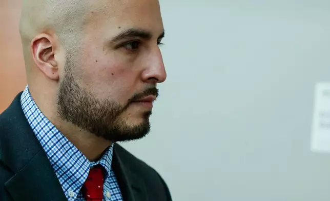New York police officer Erik Duran who is charged with hurling a plastic cooler at a man fleeing officers on a motorized scooter, causing a crash that killed the driver, arrives to his manslaughter trial at the Bronx Criminal Court in New York, Friday, Feb. 6, 2026. (AP Photo/Kena Betancur)